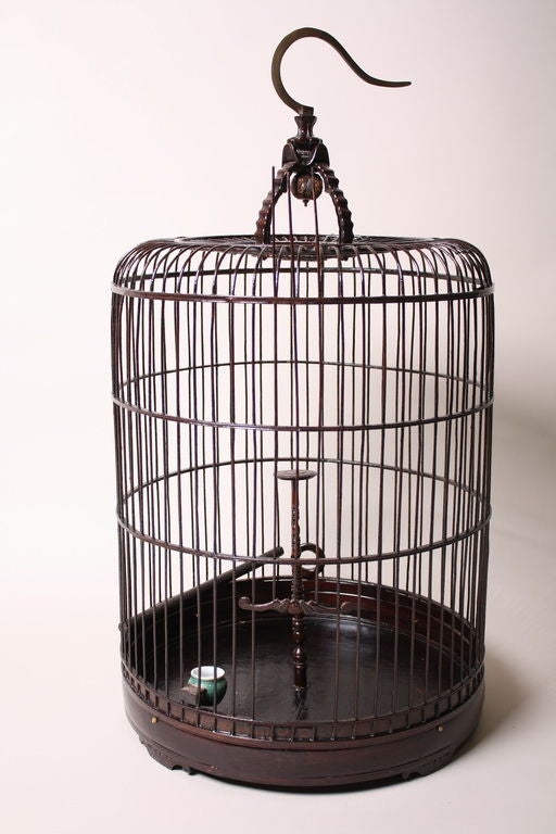 Antique Chinese bamboo birdcage. Functional opening slide door and ceramic feeding bowl. 3 available; will vary slightly from each other. Wear consistent with age and use.