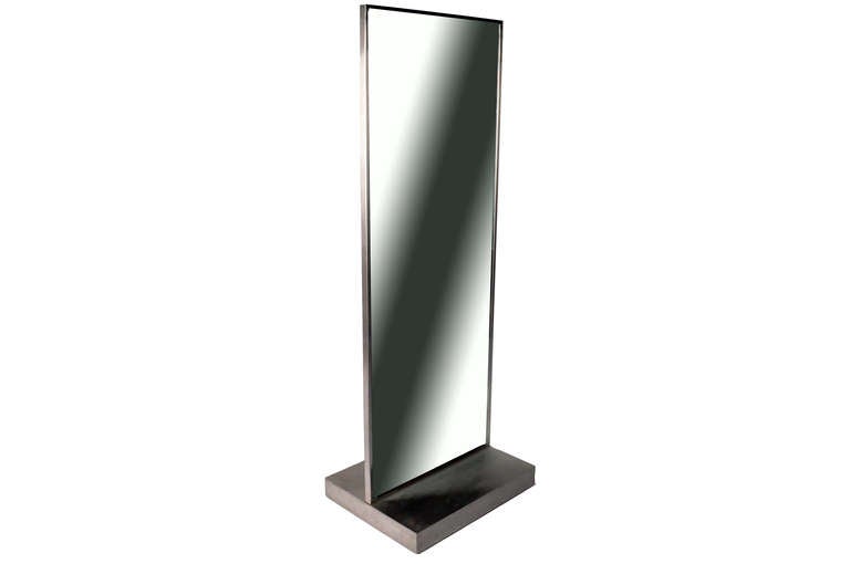 These full length mirrors are from Paris, France and made from brushed nickel and glass c. 1970.  They are easily movable as they roll on concealed wheels and are ideal for a walk-in closet or dressing room.