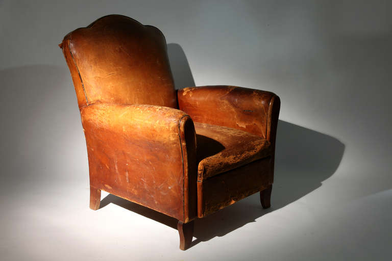 This beautiful French leather armchair is from Paris c. 1930
