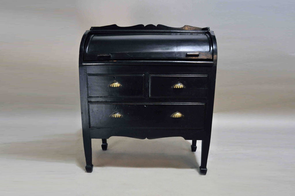 Simple, yet handsome piece accented with floral drawer pulls. Sleek curve adds a bright smile.