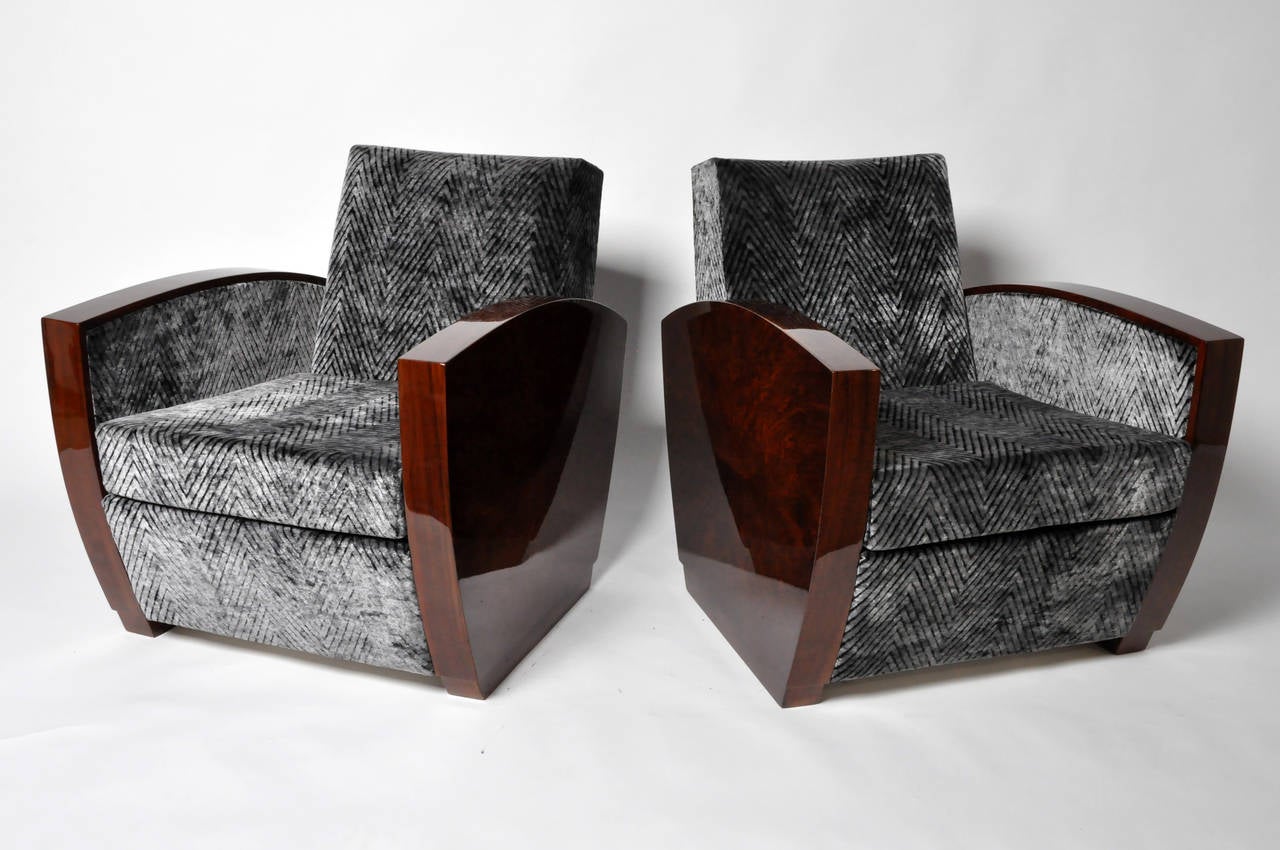 These upholstered Hungarian chairs have a high-gloss finish on their side panels and armrests. The bookmatched veneer work is exceptionally fine.