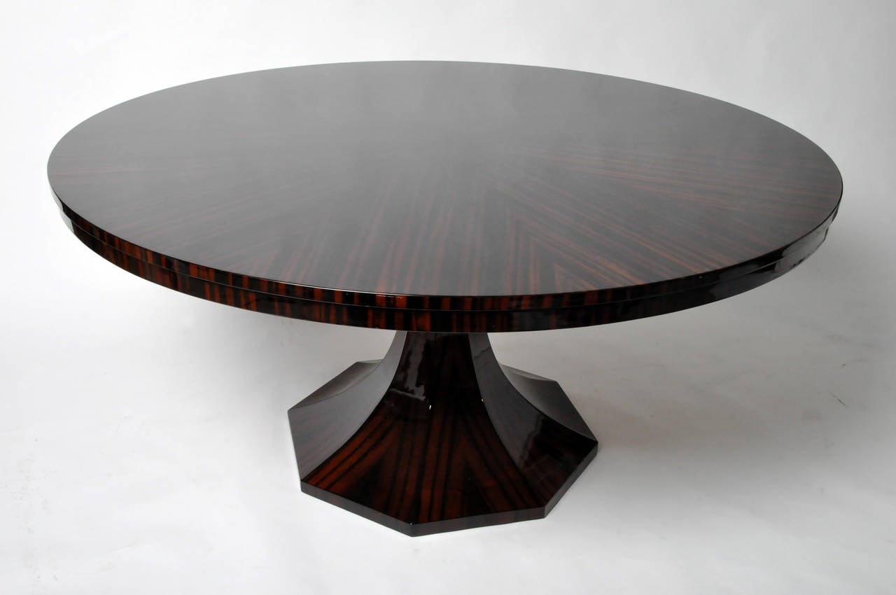 The round stepped-edge top is raised on a flared pedestal base. This piece has a high-gloss French polish finish  and is a direct copy of a 1930s Parisian Art Deco design.