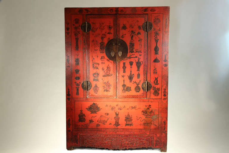 This armoire originates from the Shanxi Province. It is decorated with paintings of various urns, flower vases, figures and traditional Chinese symbols of happiness. Traditional mortise and tenon joinery have been used in the construction, with the