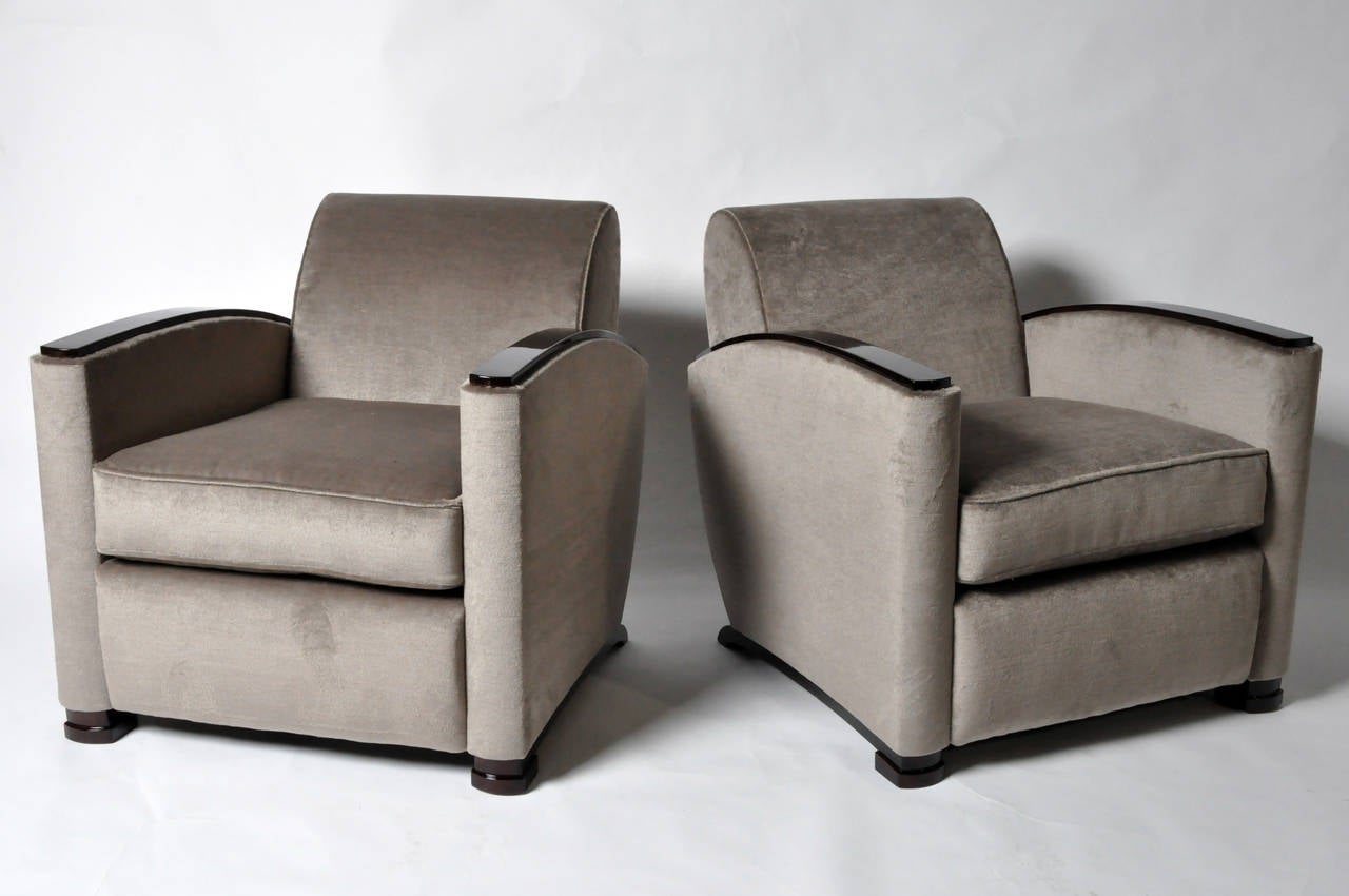 This elegant pair of armchairs is from Hungary, and has armrests made of high-gloss Walnut Veneer. These chairs are meticulously copied from a 1930's design.