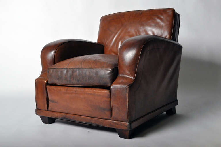 This amazing pair of leather chairs are from France c. 1940's and has its original leather. Beautifully aged patina.