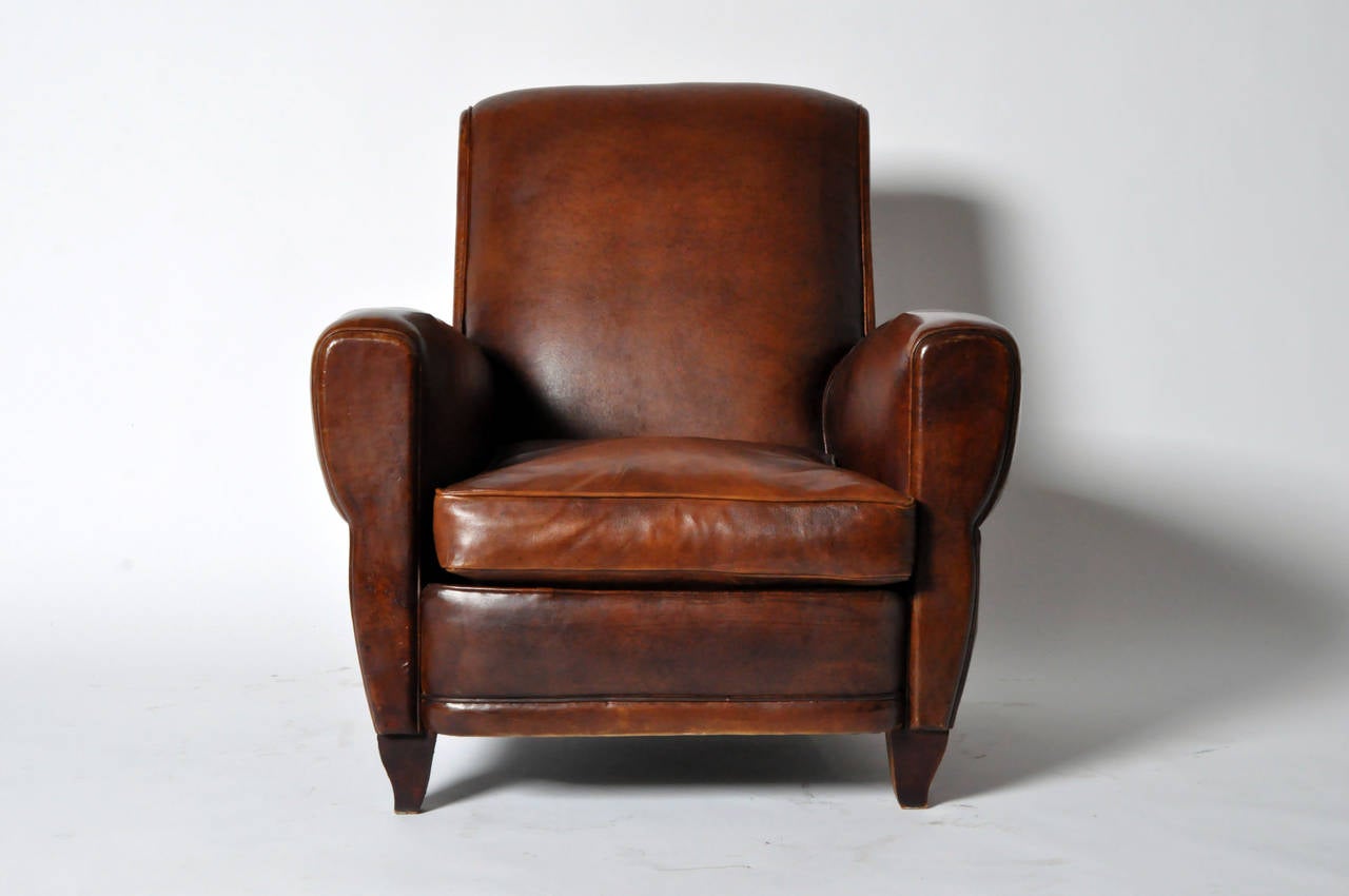 This Art Deco leather club chair is from Paris, France and made from sheepskin, circa 1940. The leather is in good condition according to its age and use.