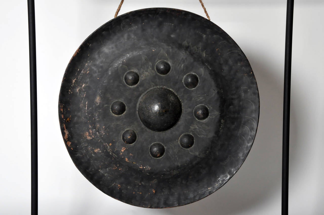 This magnificent temple gong is from Thailand and made from bronze circa early-1900s. Thai temples often had outdoor arcades featuring long rows of gongs of various sizes and designs. The gongs were traditionally given as an act of ‘merit-making’ to