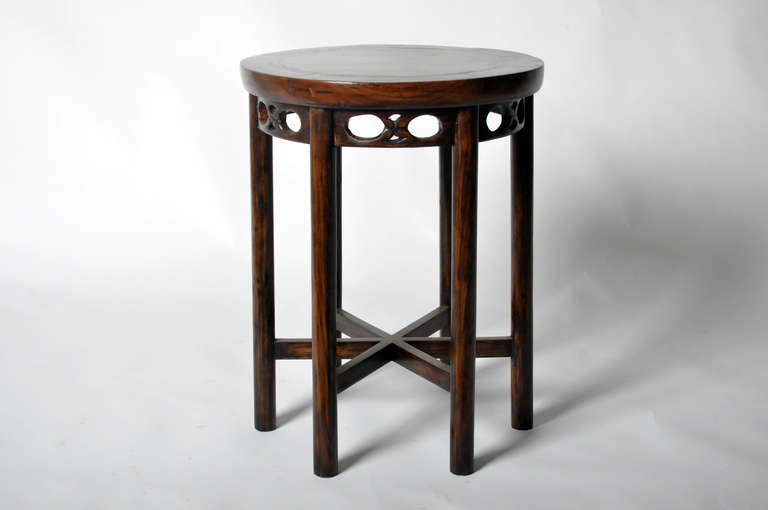 This 19th century round stool is made from elm wood and tile. This piece is from the Zhejiang Providence in China and dates to the mid-19th century. It features traditional mortise-and-tenon joinery and floating top. No nails were used and