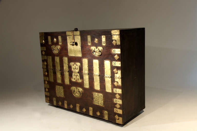 Korean blanket chest with auspicious brass hardware featuring the Chinese character for double happiness.  Made from Fir Wood with dovetail joinery.