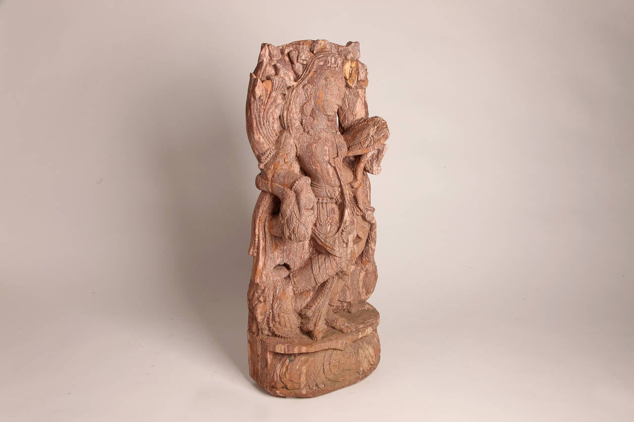 Dance is celebrated throughout India, both in traditional and contemporary forms. Many Hindu Deities are typically depicted dancing, much like this figure.

She is draped in delicately carved beads, bangles and other finely detailed jewelry that