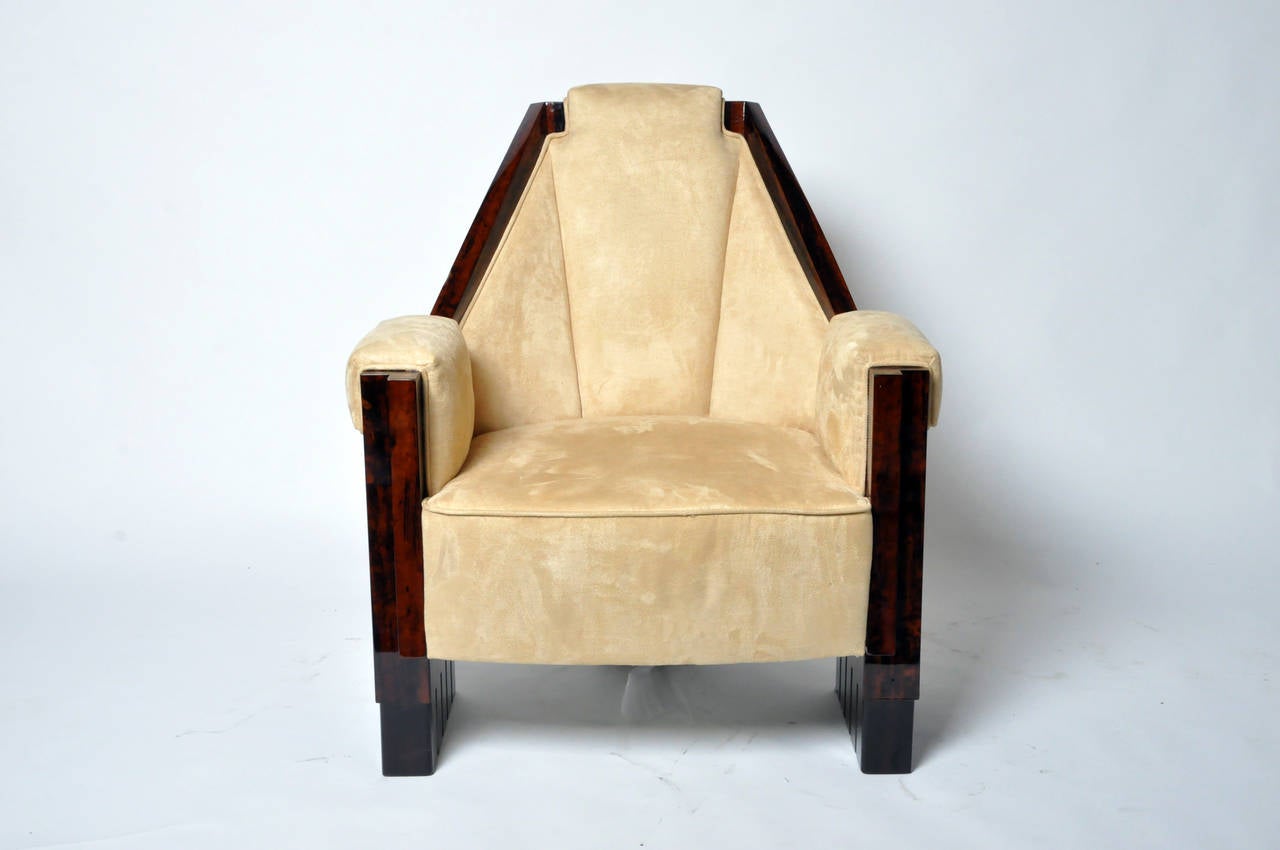 These newly-made chairs have upholstered backs, arms and seats. Their solid walnut frames have a high-gloss finish.
