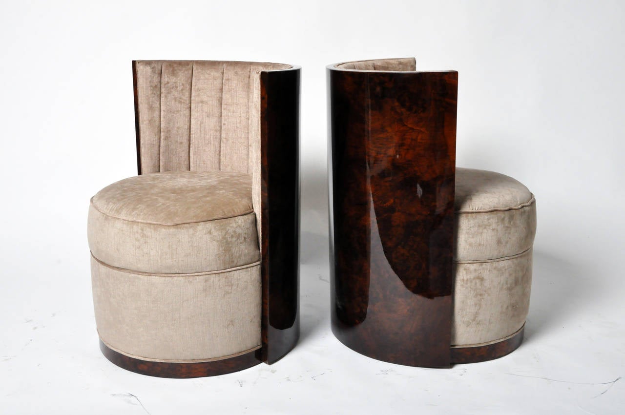 These contemporary chairs are influenced by Art Deco designs of the 1930s. This compact pair has beautiful velvet-like upholstery, and high-gloss walnut veneer backs.