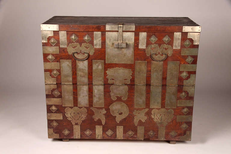 This Korean Chest has auspicious symbols for luck and prosperity with fu dog handles, birds and flowers.