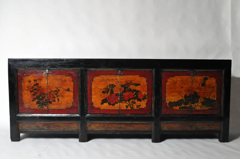 This amazing Mongolian Chest is from the early 19th Century and is made from lacquered wood. It features a beautifully painted facade and has three bottom drawers. Professional restoration done on piece.