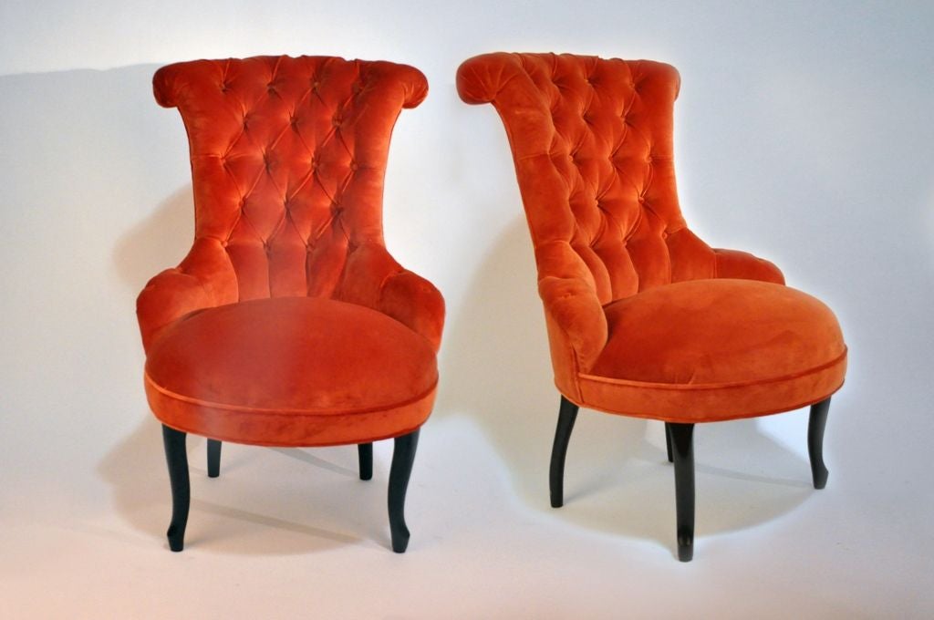 Having tufted backs, and round seats raised on cabriole legs.