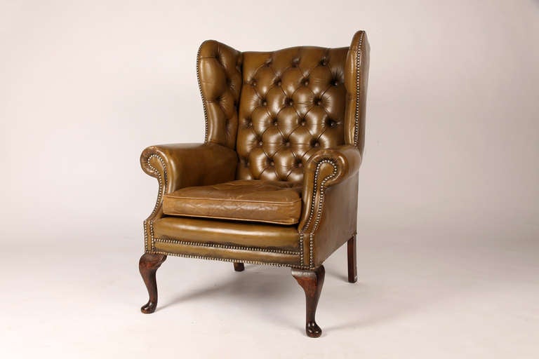 Elegant green leather chair from England.