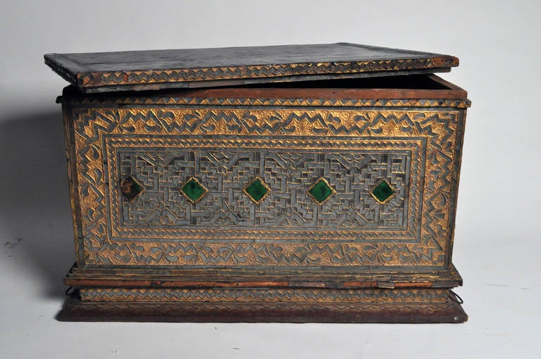 This gorgeous manuscript chest is from Burma and is made from gilt wood and beautiful glass inlay.