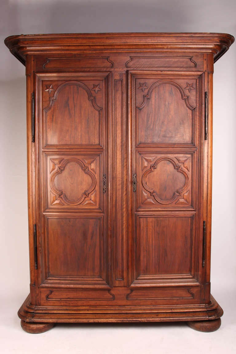 Impressive 18th Century armoire from France, made from walnut wood. The piece comes with a working lock and key.