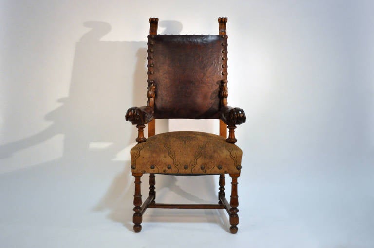 Made from solid Oak, with handsomely aged leather upholstered back and Manchettes. The cloth covered seat is raised on turned wood legs, connected by an H-form stretcher.

ONLY ONE CHAIR REMAINING