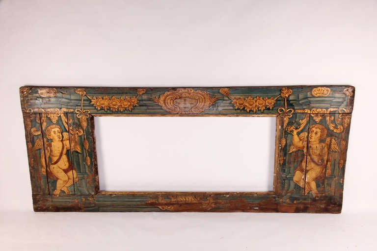 This beautiful painted wall panel is made from chestnut wood during the 18th century.