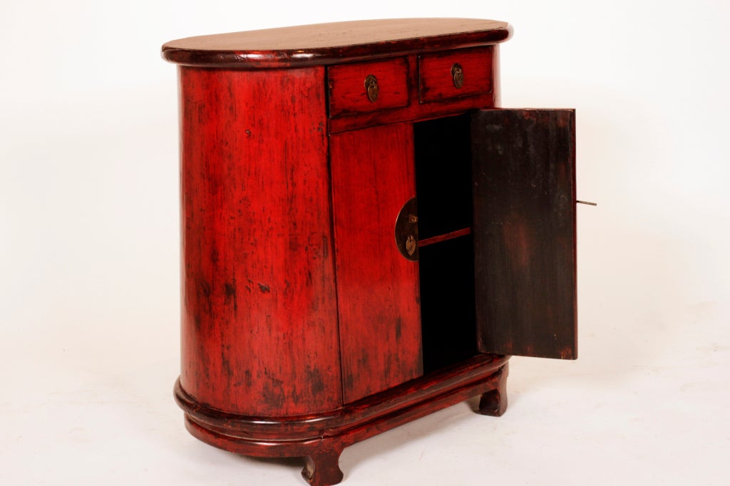 Chinese side chest with cinnabar and black lacquer finish. This piece is made from Fir Wood and comes from the Ningbo area of coastal China.