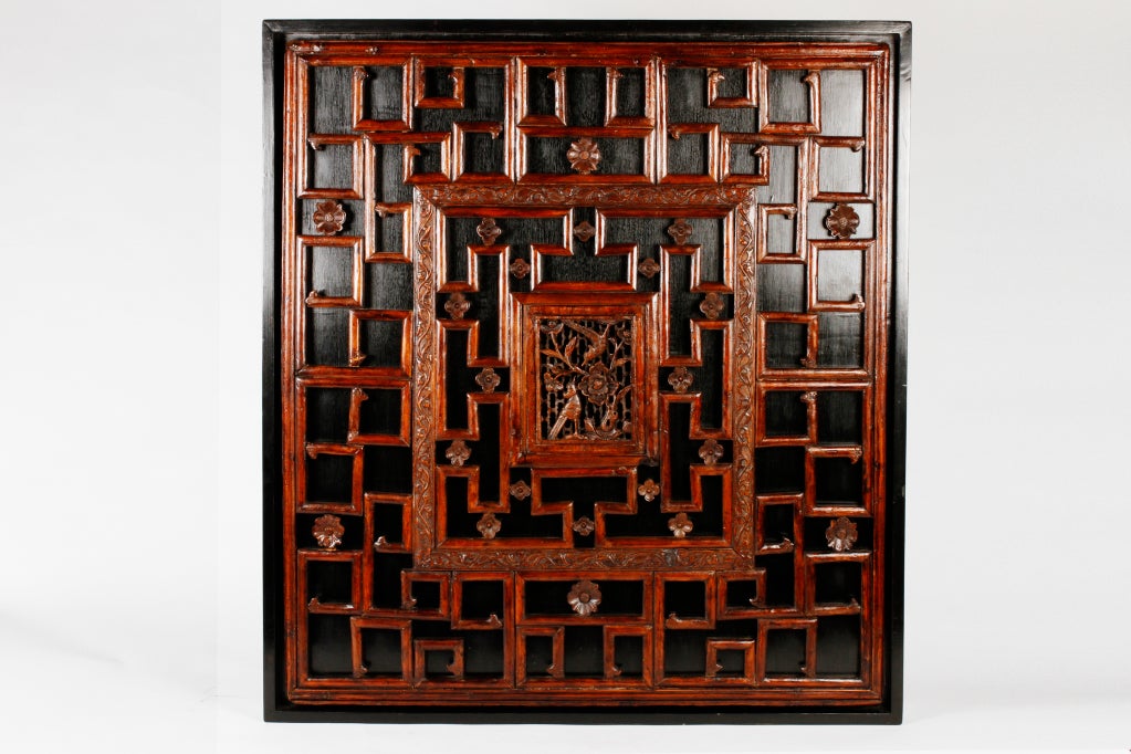 This Camphor Wood hand carved window panel has been mounted inside black lacquer frames.  Small carved lotus flowers surround the center scenes, each featuring a Magpie.  The Magpie foretells happiness and good luck. <br />
Price displayed is for