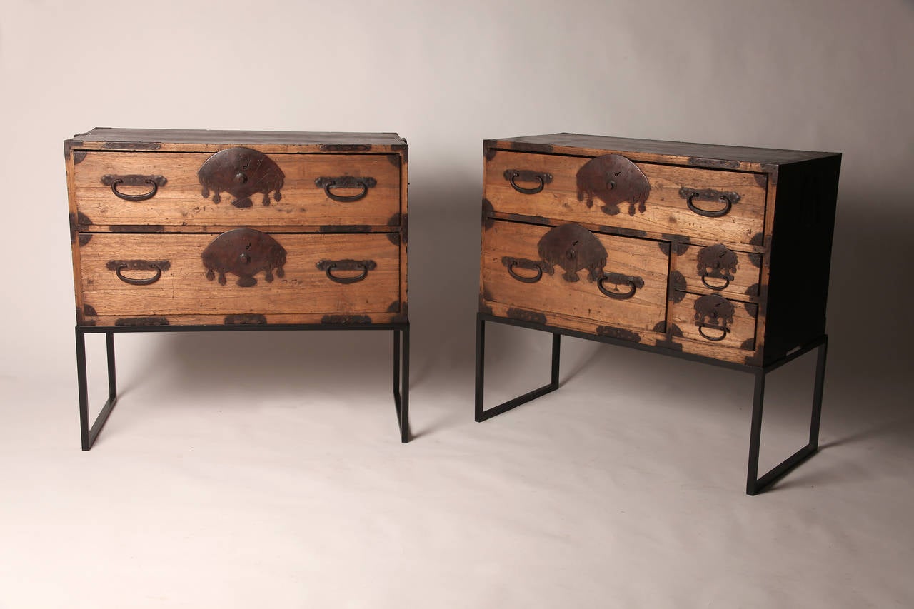 This pair of 19th Century Tansu Chests is from Japan and is made from Kiri Wood during the late 19th century. The chests features a custom made metal base (modern) and fan shaped hardware.