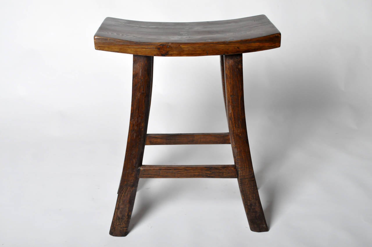 This 19th Century Wooden Stool is from the Hunan, China and made from Elm Wood c. 1870. The stool has been restored.