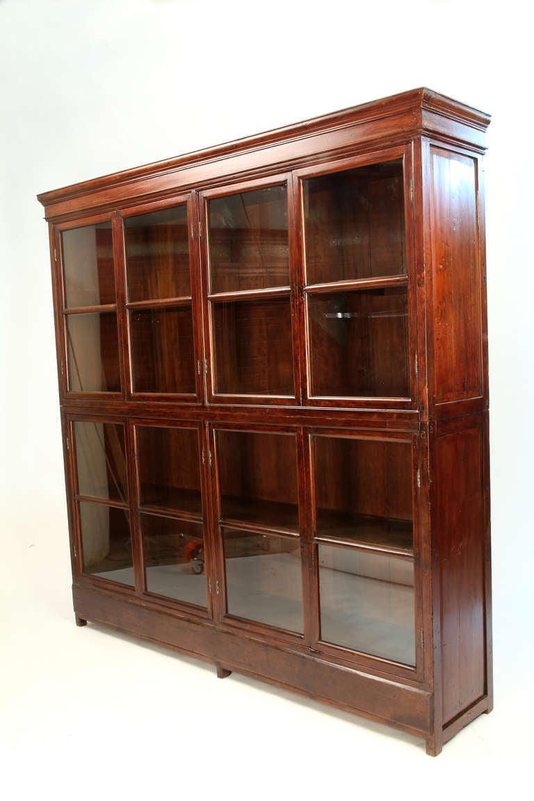 This magnificent British Colonial bookcase is made from teak wood and is from Burma circa 1900.
