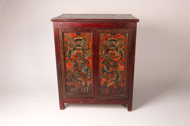 This Tibetan chest has two beautifully painted dragons on the front of the chest and is made from cedar and pine.