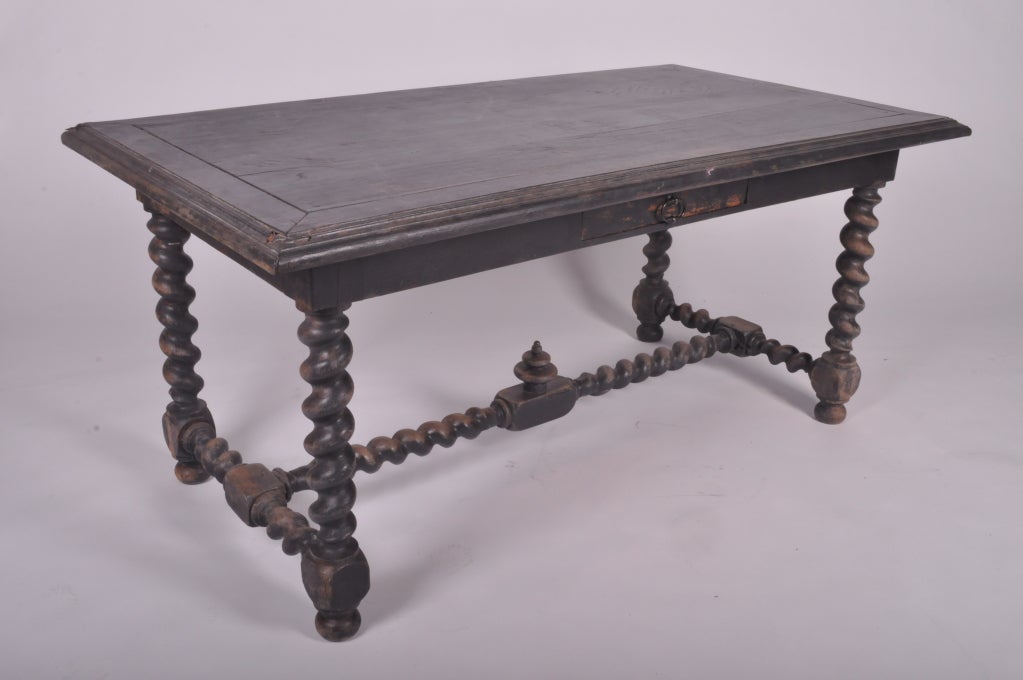 This 19th Century French oak desk with drawer was made in the Louis XIII style.  The hardware is original.
