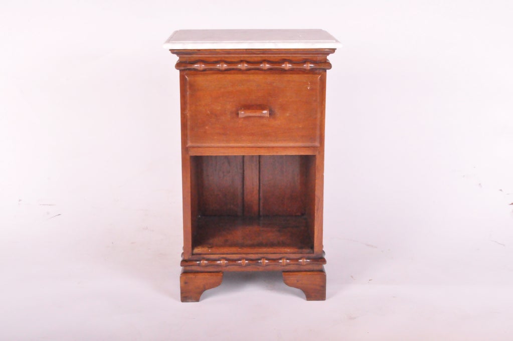 Pair of beautiful British Colonial side chest made from teak wood with marble top.