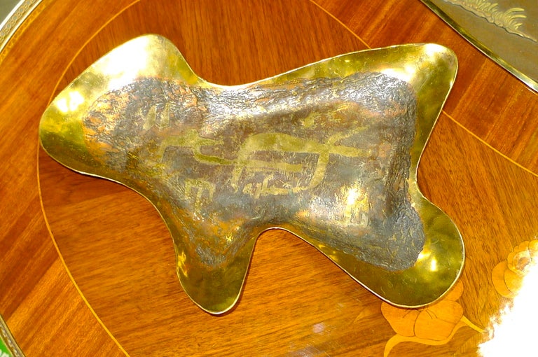 Modernist form brass tray with acid etched abstract textured design to surface by Ed Wiener  (1918-1991) , one of the most important American studio jewelers of the post WW II era.  Wiener offered modernist forms to an avant-garde clientele from his