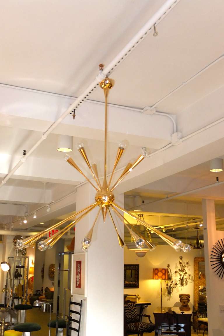 This is my favorite 1950's Italian Sputnik design with six arms up and twelve arms down, from a 5 inch diameter brass orb.  Incredibly robust and well crafted.  We have had the entire structure electroplated in 24 karat gold!  New wiring and
