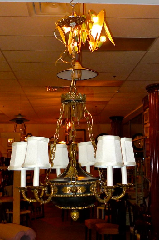 Bronze and tole French Empire style six candle chandelier.