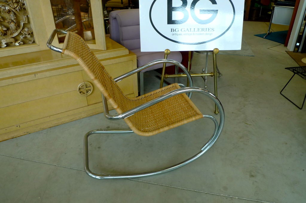 Well constructed tubular chrome and wicker vintage rocker, marked Made in Italy
Clearly a take on Mies van der Rohe's cantilevered chair designs.