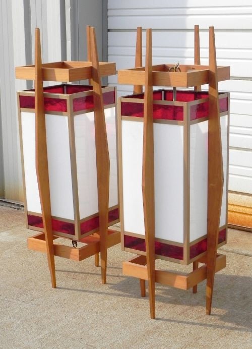 Wonderful pair of architectural lanterns which originally were designed for and hung in a mid-century built church, Frank Lloyd Wright style.
Two pairs available. See separate listing.
Solid teak frame with stained glass (white and red).
Price shown