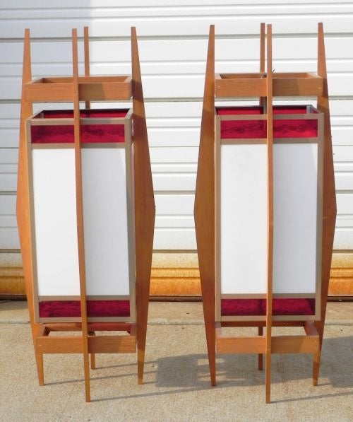 Wonderful pair of architectural lanterns which originally were designed for and hung in a mid-century built church, Frank Lloyd Wright style.
Two pairs available. See separate listing.
Solid teak frame with stained glass (white and red).
Price shown