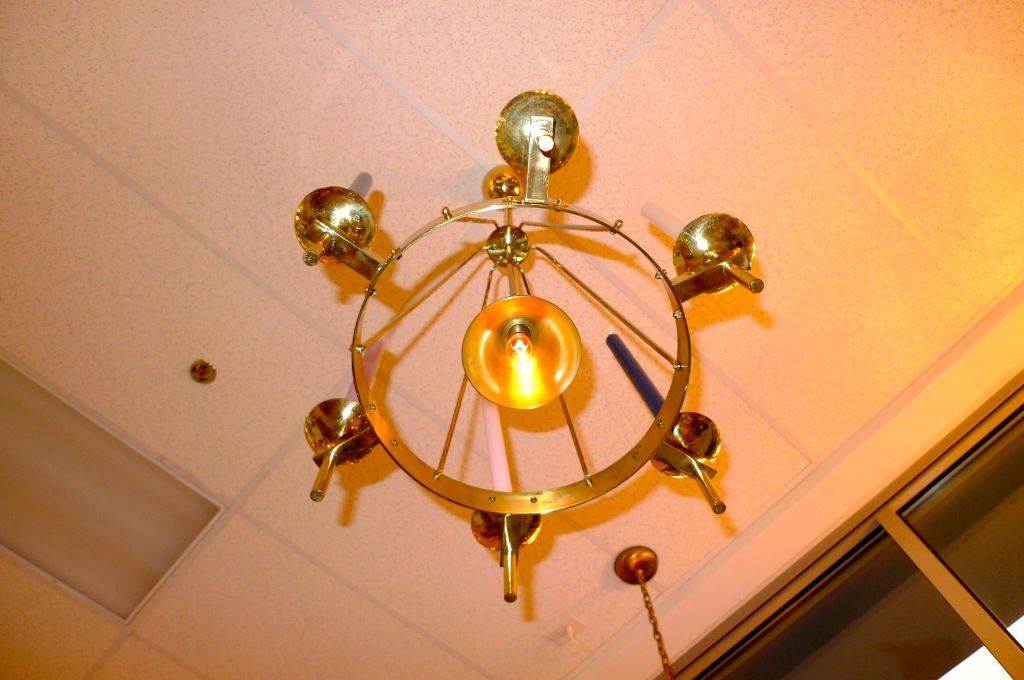 Swedish brass chandelier with both electric light and candles by Sölve Carlsson of Helsingborg.