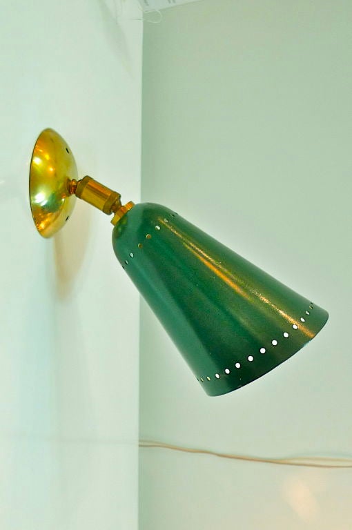 Single wall or cabinet mounted sconce with articulating swivel joint.  Green enameled aluminum cone.