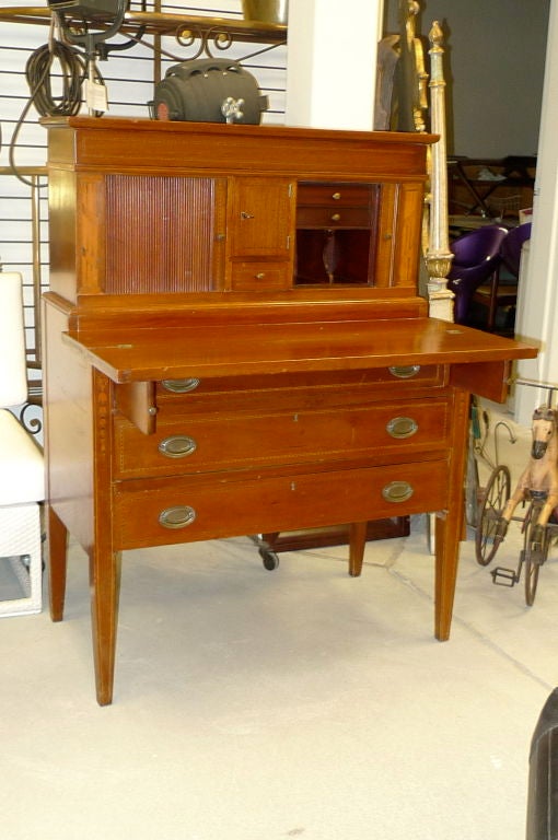 Heppelwhite Inlaid Tambour Secretary Desk with Hinged Writing Lid Over Three Drawers.  Federal style.  Mahogany and satinwood.<br />
<br />
Wonderful scale.<br />
<br />
Secret drawers. Original lock and key. Hand planed drawer bottoms.
