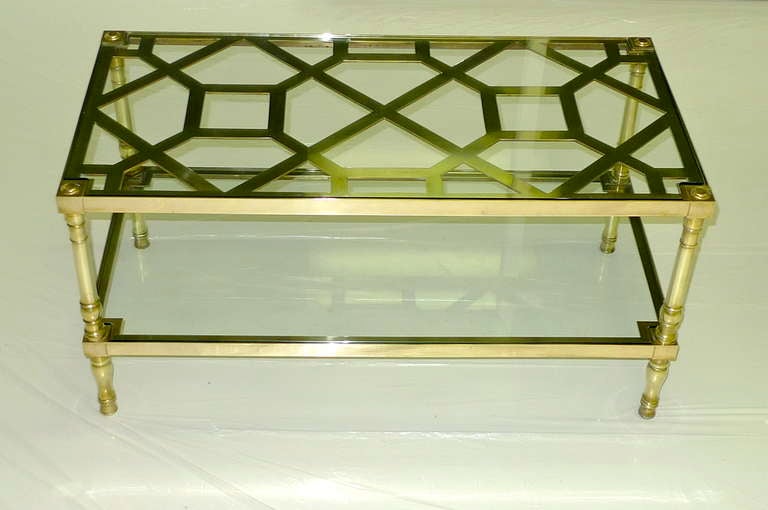 BG GALLERIES NEW YEAR SALE Jan 2024

Stunning bi-level coffee table in solid cast brass with geometric arabesque fretwork design on top level,  topped with clear glass with notched corners.  Lower level also has clear glass with notched corners.
