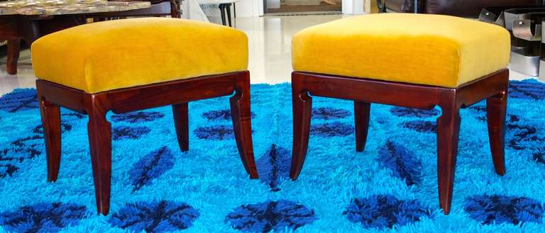 A very smart pair of 1940's Italian foot stools or small benches.
The walnut has been refinished and the gold velvet is original.
Elegantly carved legs.
The wood base is 12 inches high so the cushion is 5.25