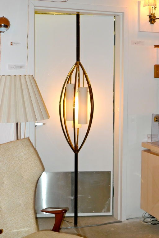 Sophisticated tension pole floor lamp with an elegant brass 'birdcage' design and three opaline glass cylinder shades. Accepts three standard light bulbs with 3-way switch on pole.<br />
<br />
Can also be used with X-base to use as independent