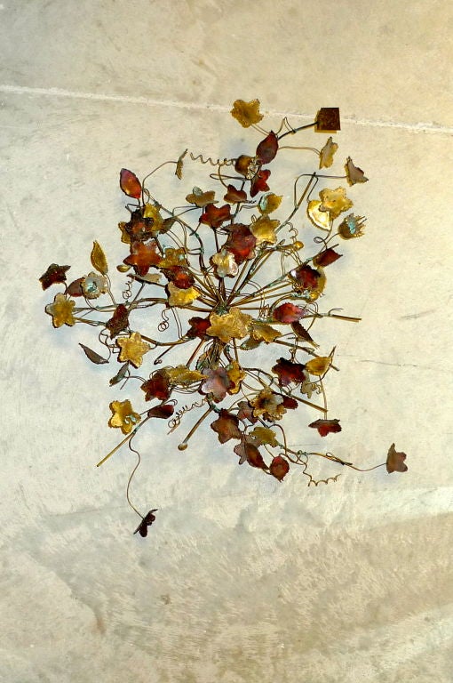 Brutalist metal craft cluster of leaves, skillfully executed.  <br />
<br />
Metal tag inscribed with initials which appear to read 