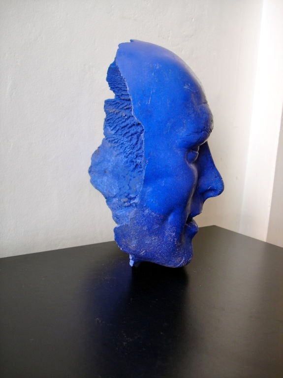 A 1970's sculpture in the form of a facial mask cast in resin colored Yves Klein blue