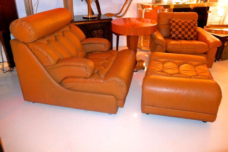 Comfort need not take a back seat to gorgeosity in this ridiculously comfortable lounge chair and ottoman by DeSede, Switzerland in caramel leather and unique quilted tufting.