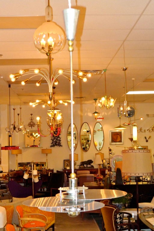 Stunning Bauhaus influenced French modernist hanging ceiling light, circa 1950. <br />
<br />
Legendary designe, Rene Herbst, often used metal elements to create sculptural lighting fixtures as art statements. This rare pendant chandelier is