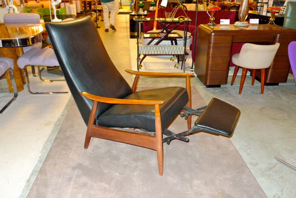 A pair of Milo Baughman recliners for Thayer Coggin. One black vinyl, the other green vinyl.  Both with original Thayer Coggin labels. Original un-restored condition, ready to be recovered in your own material.<br />
<br />
Price is $1200 per