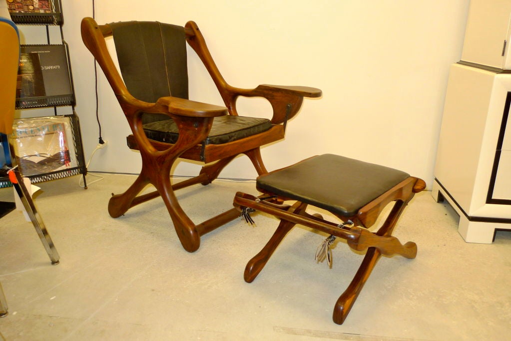 Don Shoemaker for Senal, Mexico, Cocobolo Rosewood Sling Swinger Chair & Ottoman. 
An original biomorphic Sling Swinger Chair and Ottoman in tropical Cocobolo rosewood and black leather by the great organic modernist of Mexico, Don Shoemaker for